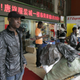 An African man stands near a shopping mall in the southern Chinese city of Guangzhou in Guangdong province March 27, 2009. In the past few years, tens of thousands of African and Arab traders have thronged to export hubs like Guangzhou and Yiwu to seek their fortunes, sourcing cheap China-made goods back home to massive markups in a growing, lucrative trade. Picture taken March 27, 2009. To match feature